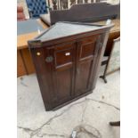 AN 18TH CENTURY OAK CORNER CUPBOARD WITH TWO PANELLED DOORS, 31" WIDE