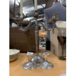 A SILVER PLATED FIVE CANDLE CANDELABRA AND A FURTHER TWO SMALLER SILVER PLATE CANDLE HOLDERS