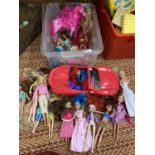 A BOX OF DOLLS TO INCLUDE BRATZ ETC AND A BARBIE IN A SPORTS CAR
