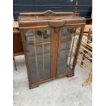 AN EARLY 20TH CENTURY OAK DISPLAY CABINET, 37 INCHES WIDE