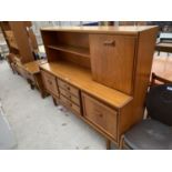 A RETRO TEAK CABINET WITH THREE DOORS AND THREE DRAWERS