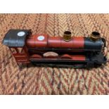 A RED TINPLATE MODEL OF A 'GREAT WESTERN RAILWAY' TRAIN