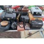 A PROJECTOR AND VARIOUS CAMERA CASES