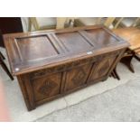 A CARVED PANEL OAK BLANKET CHEST