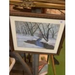 A FRAMED AND SIGNED PRINT OF A WINTER WOODLAND SCENE