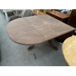 A MAHOGANY DROP LEAF DINING TABLE OF MAHOGANY TRIPOD SUPPORT