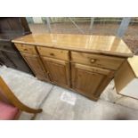 A PINE DUCAL DRESSER BASE ENCLOSING THREE DRAWERS AND THREE CUPBOARDS, 51" WIDE