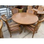A CIRCULAR 'CLASSIC FURNITURE' DINING TABLE AND FOUR ELBOW CHAIRS WITH VERTICAL STRIPES, 47"