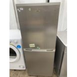 A GREY LOGIK UPRIGHT FRIDGE FREEZER BELIEVED IN WORKING ORDER BUT NO WARRANTY