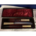 A THREE PIECE BOXED CARVING SET