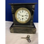 A BLACK MARBLE MANTEL CLOCK