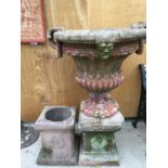 A LARGE TERRACOTTA URN ON A PEDESTAL BASE MEASURING 106CM IN HEIGHT AND ONE FURTHER PEDESTAL BASE
