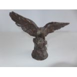 A PATINTED SPELTER MODEL OF AN EAGLE HEIGHT 19CM, WIDTH 26CM, BARES NAME EICHBERG
