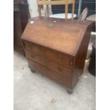 A GEORGE III OAK AND CROSSBANDED BUREAU WITH FITTED INTERIOR AND THREE DRAWERS 38 INCHES WIDE