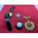 FIVE ITEMS TO INCLUDE A VINTAGE WATCH, A ROYAL ENGINEERS BADGE, AN RWF BADGE, POCKET WATCH AND