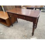 A VICTORIAN MAHOGANY SIDE TABLE ENCLOSING TWO DRAWERS, ON TURNED LEGS, 42" WIDE