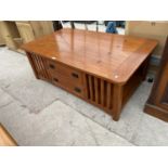 AN OAK COFFEE TABLE WITH TWO DRAWERS