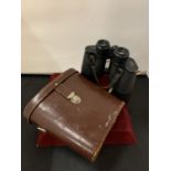 A VINTAGE PAIR OF CARL ZEISS JENOPTEM BINOCULARS WITH LEATHER CASE