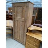 AN EARLY 20TH CENTURY LIMED OAK HALL WARDROBE, 31" WIDE