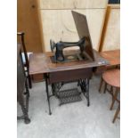 A SINGER TREADLE SEWING MACHINE