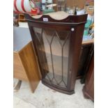 A MAHOGANY CORNER CABINET WITH GLAZED PANEL DOOR