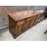 A MODERN WALNUT DRESSER BASE ENCLOSING THREE DRAWERS AND THREE CUPBOARDS, 60" WIDE