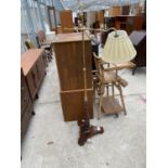 A REGENCY STYLE ADJUSTABLE READING LIGHT WITH BRASS POLE, ON MAHOGANY STAND