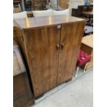 AN ART DECO WALNUT TWO DOOR WARDROBE, 33" WIDE