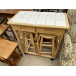 A BEECH KITCHEN TABLE WITH TWO DRAWERS AND TWO INSET STOOLS