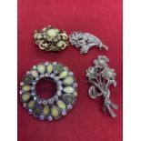 FOUR ORNATE BROOCHES