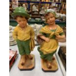 A PAIR OF 1930S ART DECO FIGURES OF A YOUNG BOY AND GIRL