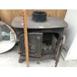 A VINTAGE CAST IRON DOUBLE DOOR LOG BURNER