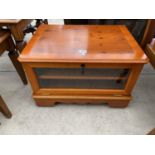 A YEW WOOD TV CABINET WITH GLAZED FALL FRONT