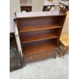 A STAG MINSTREL MAHOGANY THREE TIER BOOKCASE WITH LOWER DRAWER
