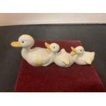 A BESWICK DUCK WITH TWO DUCKLINGS