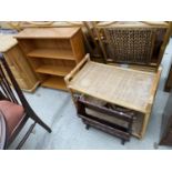 A PINE THREE TIER BOOKCASE, A PINE MAGAZINE RACK AND A BAMBOO TABLE WITH FOUR SMALL WICKER BASKETS