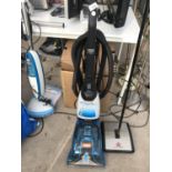 A VAX RAPIDE DELUXE CARPET WASHER AND A BISSELL PERFECT SWEEP