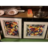 A PAIR OF BLACK FRAMED ABSTRACT PRINTS