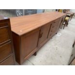 A G-PLAN 'FRESCO' TEAK SIDEBOARD, 84" WIDE, ENCLOSING FOUR CUPBOARDS AN FOUR DRAWERS