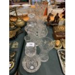 AN ASSORTMENT OF CUT GLASS TO INCLUDE VASES AND TWO DECANTERS