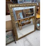 A RECTANGULAR GILT FRAMED BEVEL EDGE MIRROR