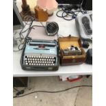 A BROTHER DELUXE TYPE WRITER, A PHILLIPS LIGHT AND A VINTAGE CAMERA