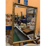 AN ORNATE GILT EDGED SQUARE FRAMED MIRROR