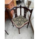 A VICTORIAN MAHOGANY CORNER CHAIR WITH DECORATIVE CARVING AND FRETWORK