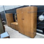 A MID 20TH CENTURY OAK THREE PIECE BEDROOM SUITE COMPRISING TWO WARDROBS AND A DRESSING CHEST