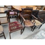 A REGENCY ROSEWOOD DINING CHAIR, VICTORIAN ELM ELBOW CHAIR AND AN EBONISED CANE SEATED FIRESIDE