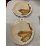 A PAIR OF CLARICE CLIFF DECORATIVE PLATES