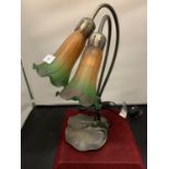 A METAL TABLE LAMP WITH COLOURED GLASS SHADES IN AN ART DECO STYLE