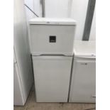 A WHITE ZANUSSI UPRIGHT FRIDGE FREEZER BELIEVED IN WORKING ORDER BUT NO WARRANTY