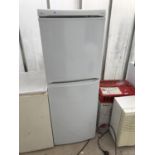 A WHITE LEC UPRIGHT FRIDGE FREEZER BELIEVED IN WORKING ORDER BUT NO WARRANTY